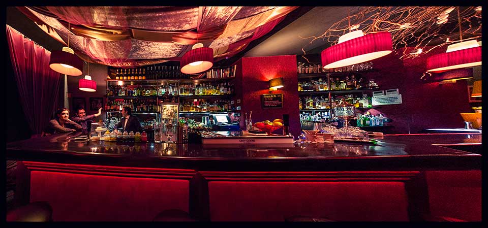 Dim cocktail lounge interior at Slow Barcelona in the Eixample