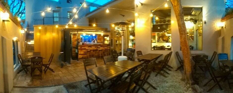 Craft beer taps and glasses at Cerveceria Jerome brewpub in Palermo Buenos Aires