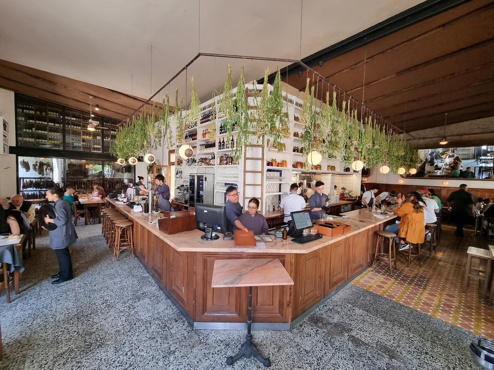 Wine shelves and a long counter at El Preferido de Palermo in Buenos Aires