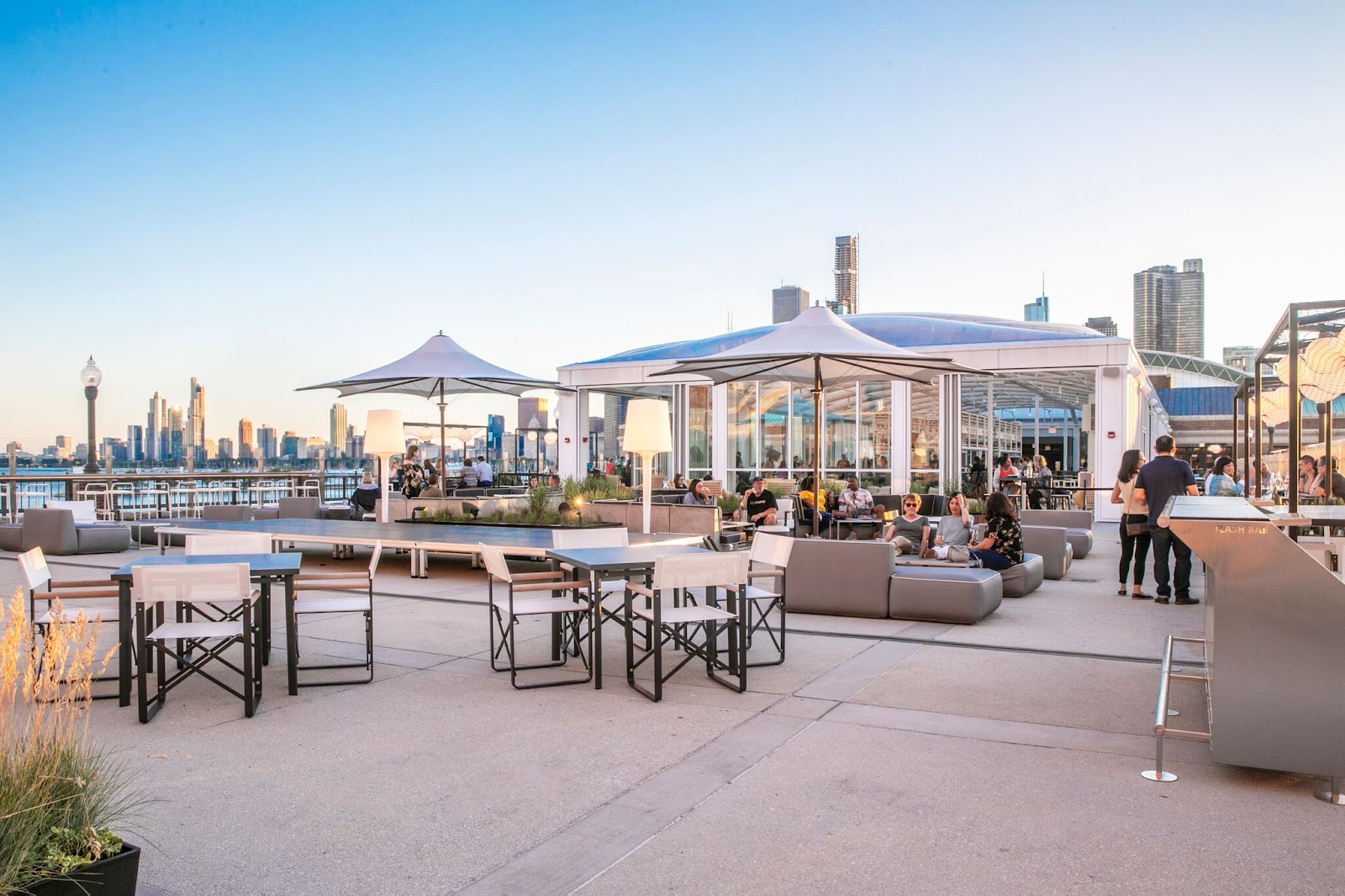 Offshore rooftop bar deck above Navy Pier with Chicago skyline
