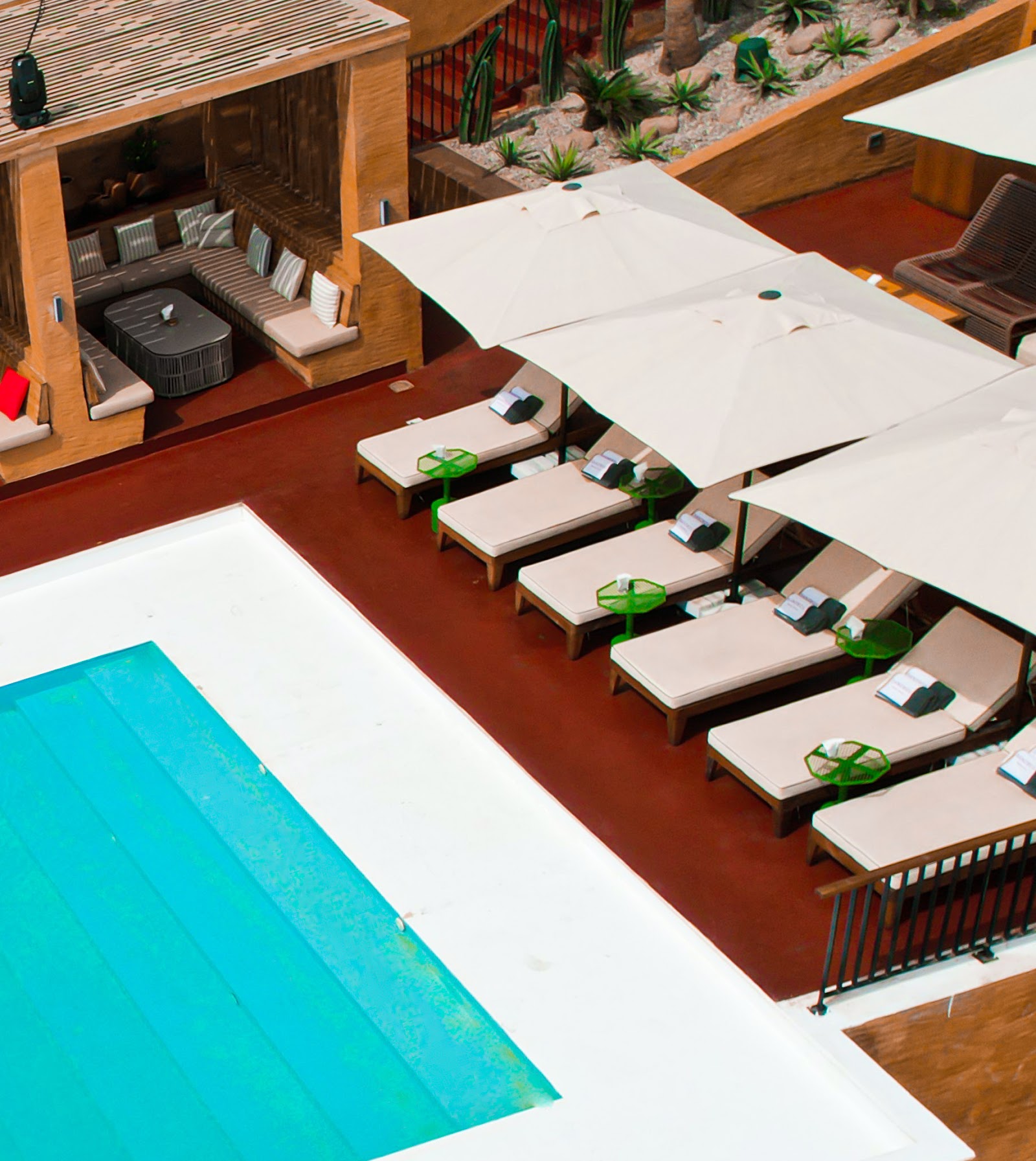 Beach club terrace with canopy beds at sunset, similar in mood to Sandbox Beach Club on Labadi Beach Accra
