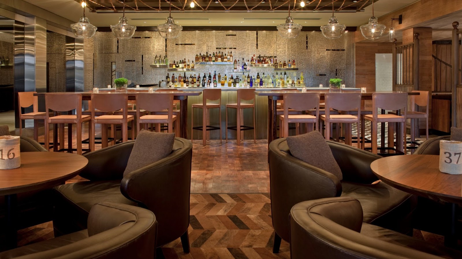 Leather and wood hotel bar interior, similar in mood to Pony Line in Buenos Aires
