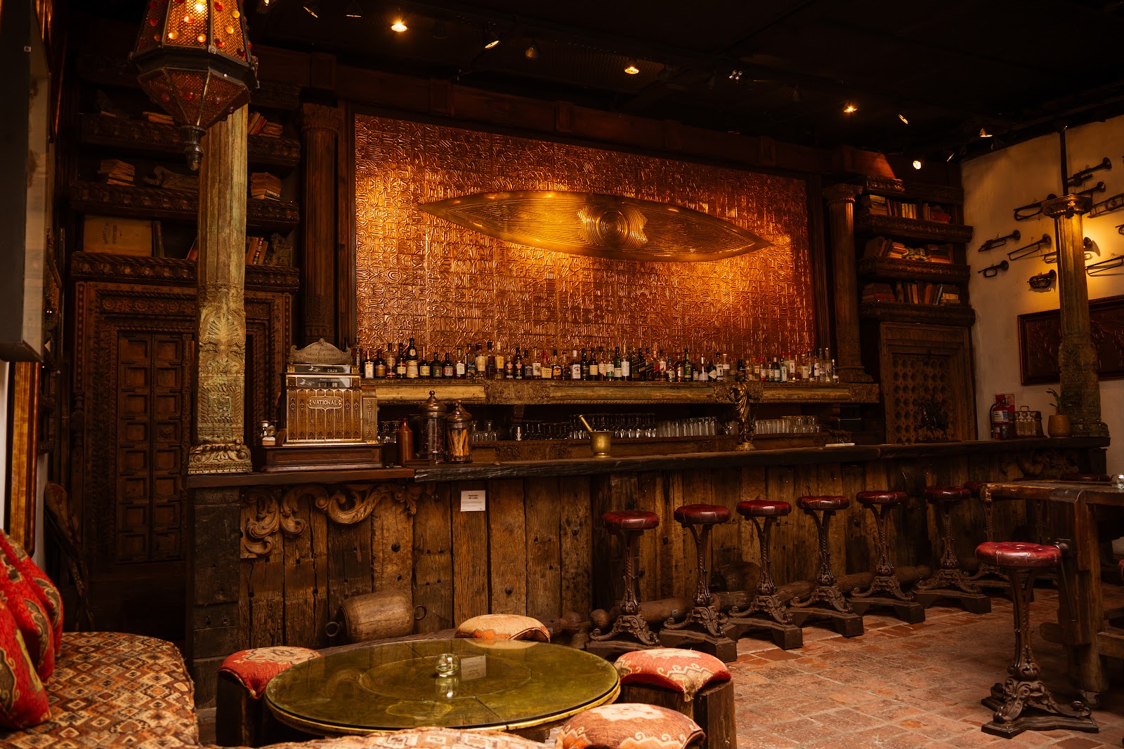 Dim mansion bar interior with warm amber light
