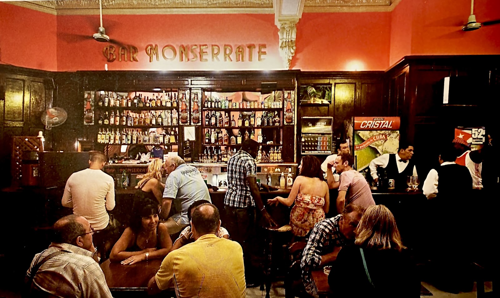 Musicians playing in a dim bar room