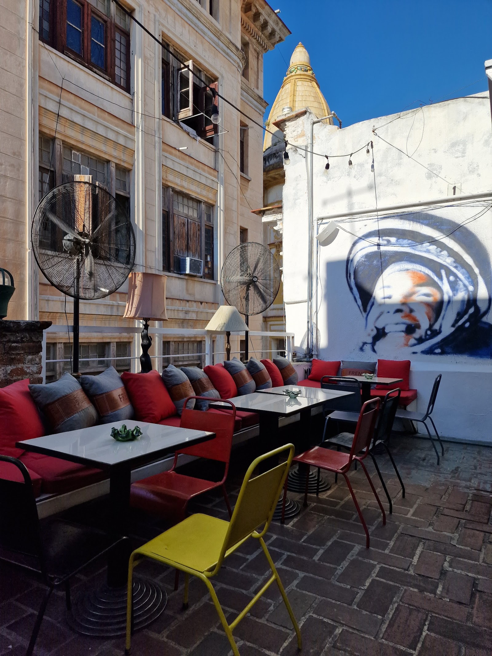 Rooftop bar terrace at dusk with warm lighting