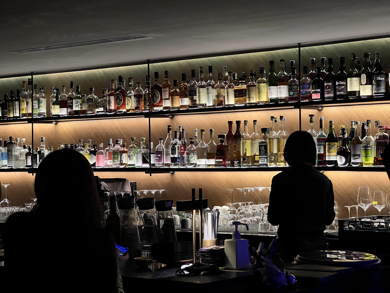 Bar counter under neon light at night