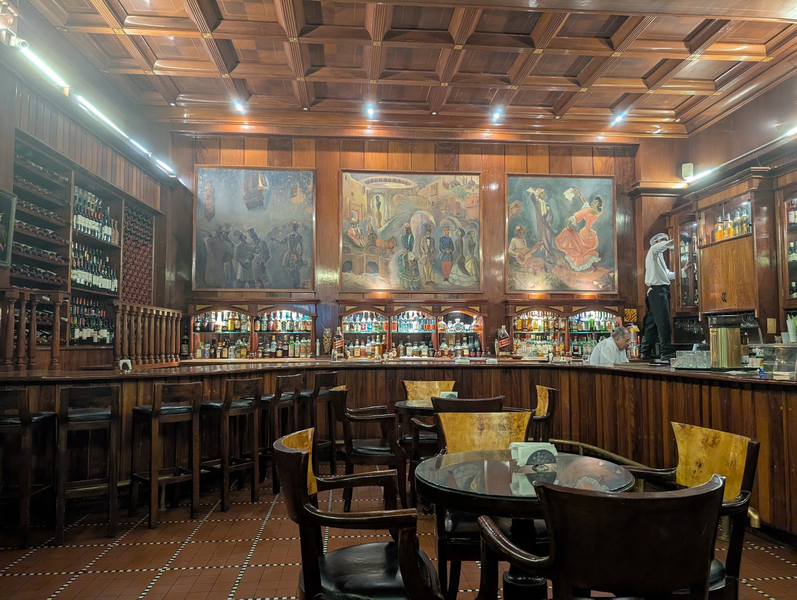 Classic hotel bar with bottle shelf, similar in mood to Bar Maury in Lima