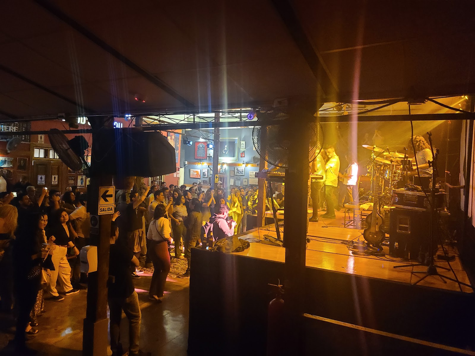 Musicians playing in a dim bar