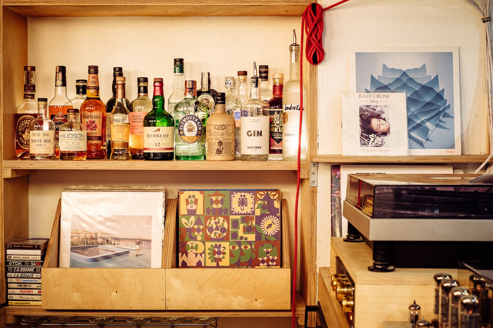 Dim basement listening bar with vinyl and warm lighting in Hackney London