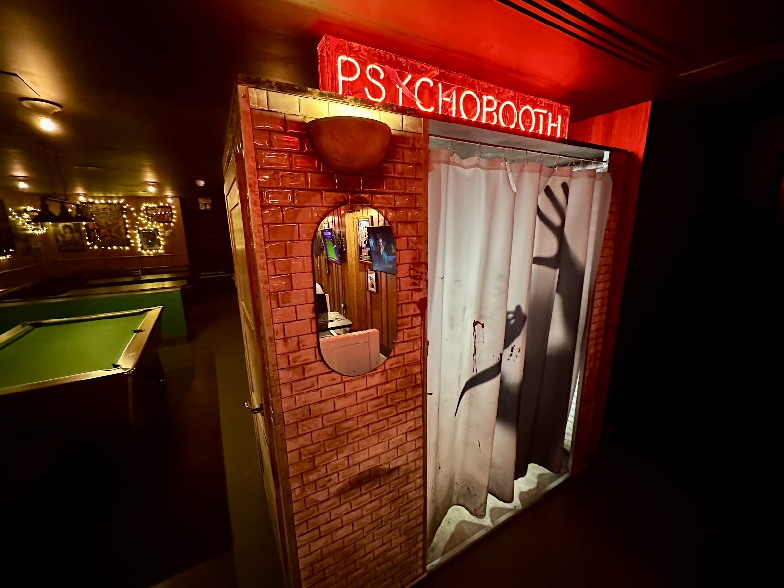 Interior of Bloodsports sports bar by MEATliquor with screens in Covent Garden, London