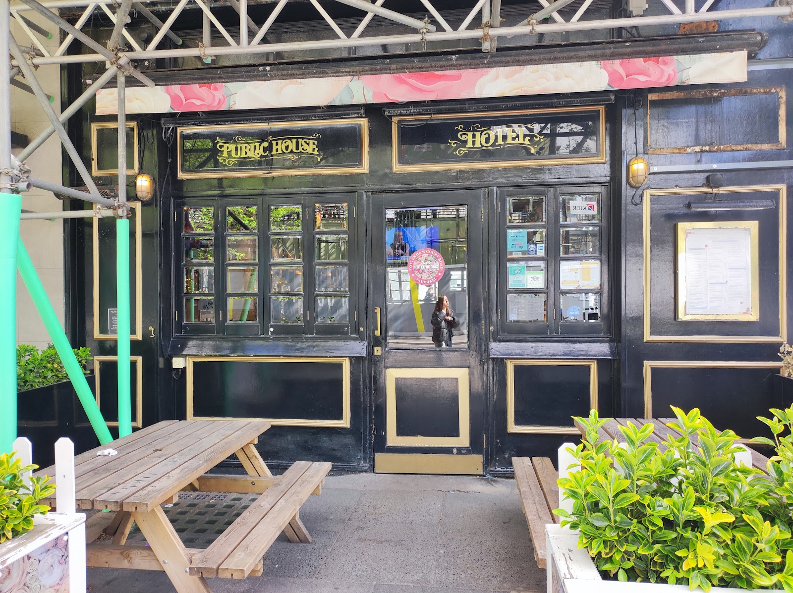 Interior of Fitzrovia Belle sports pub with screens on Tottenham Court Road, central London
