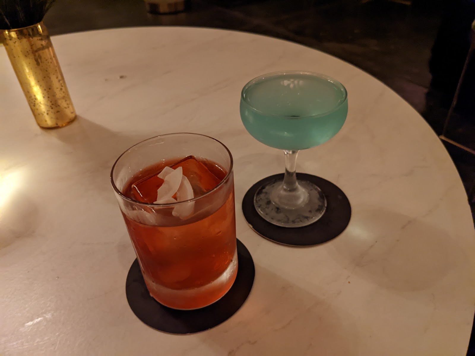 Cocktail close up on a dark bar
