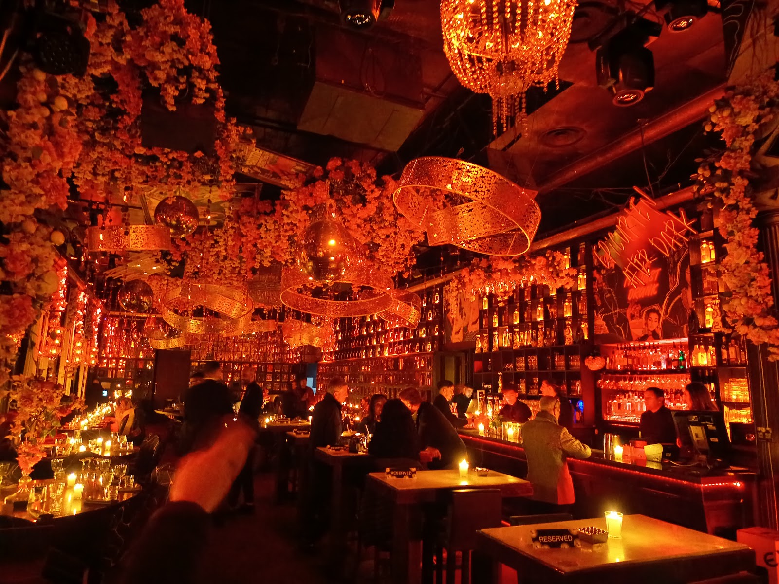 Warm dark bar interior with low seating