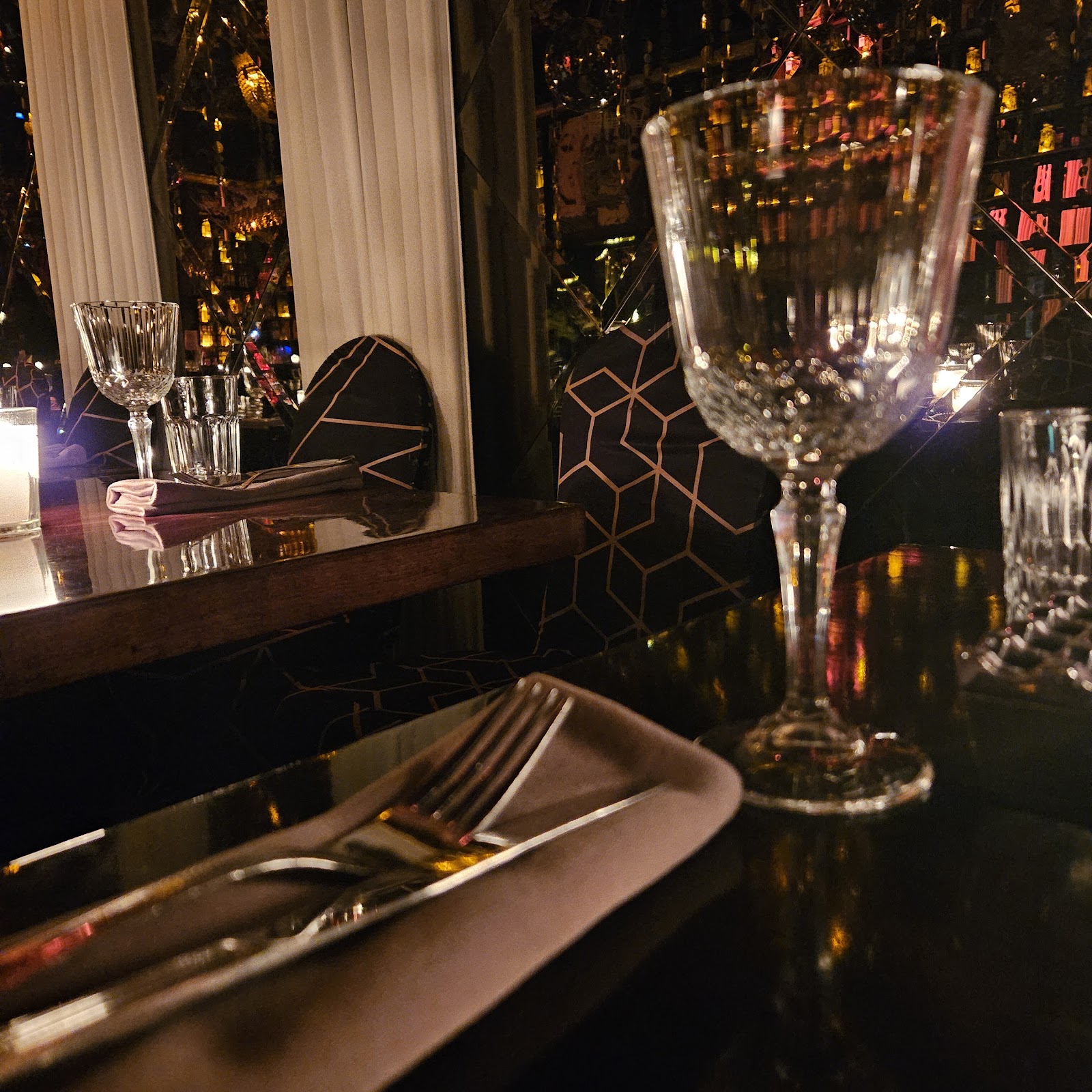 Coupe cocktail at a marble bar