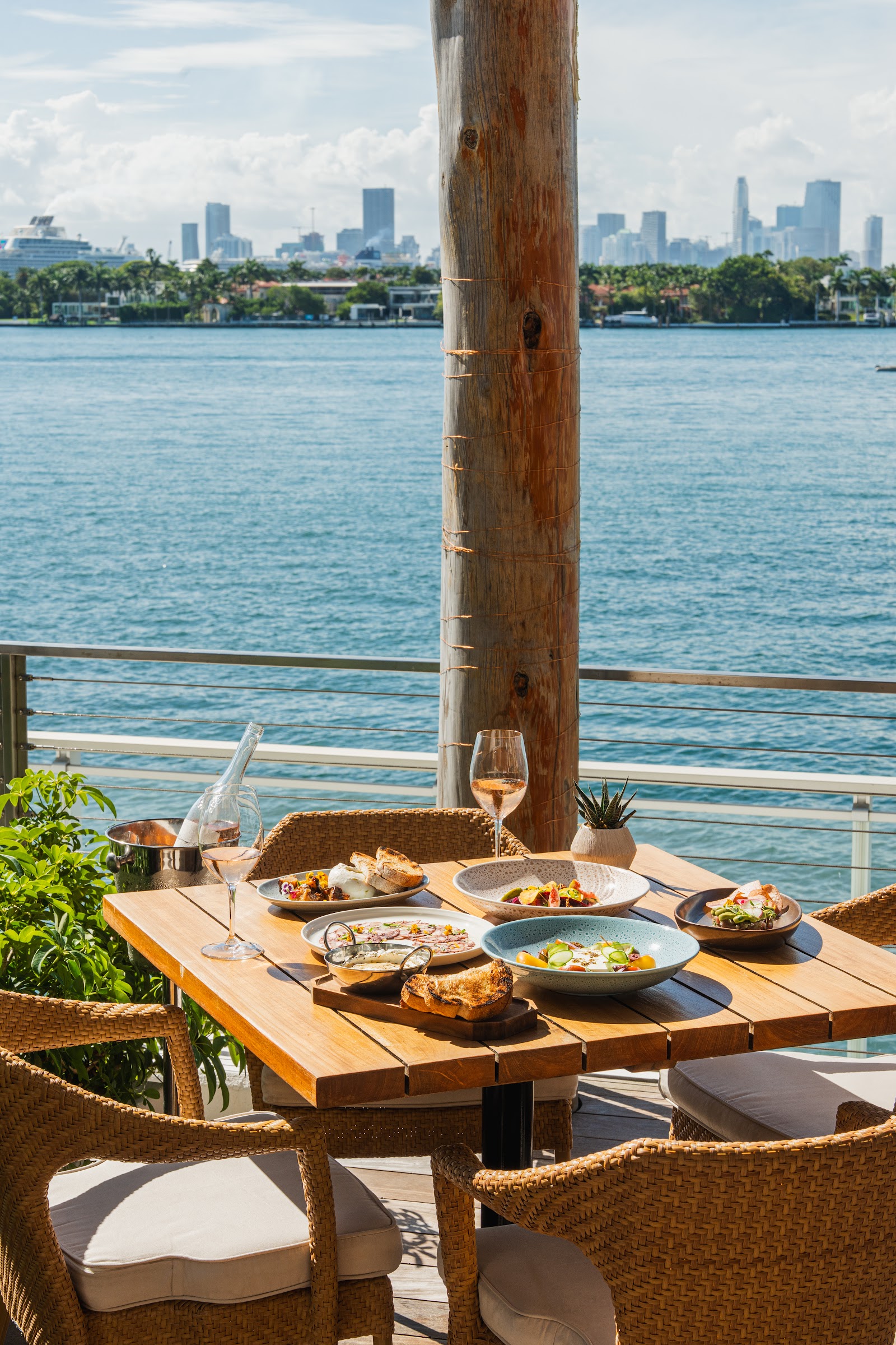 Waterfront pool deck and bar at Baia Beach Club, Mondrian South Beach