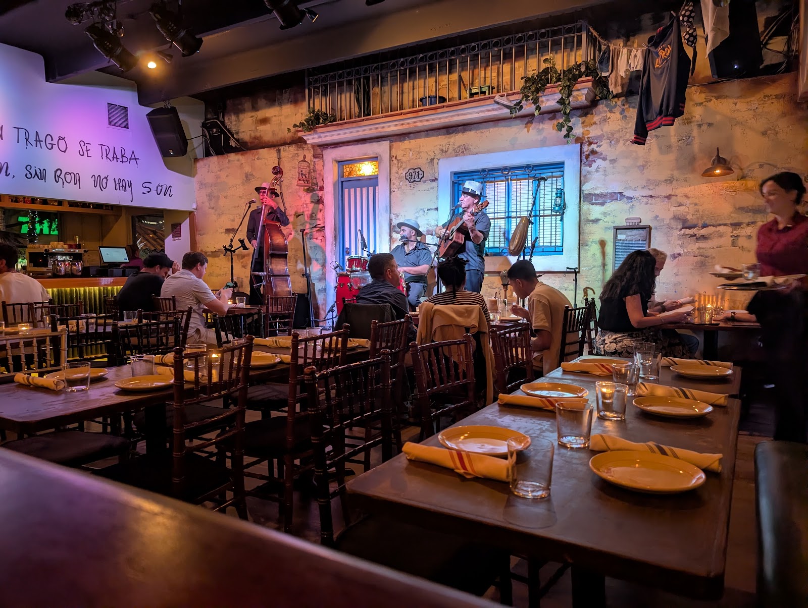 Live band playing in a dim bar room