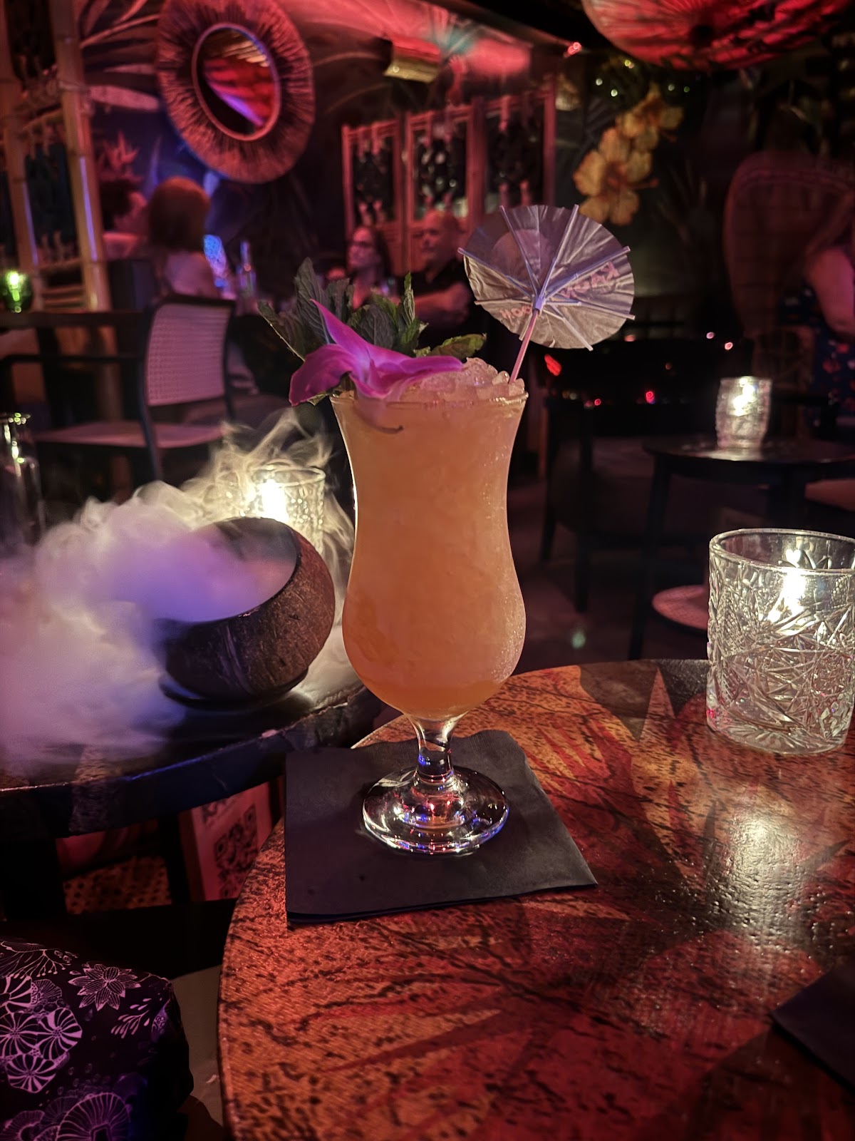 Cocktail close up on a dark bar