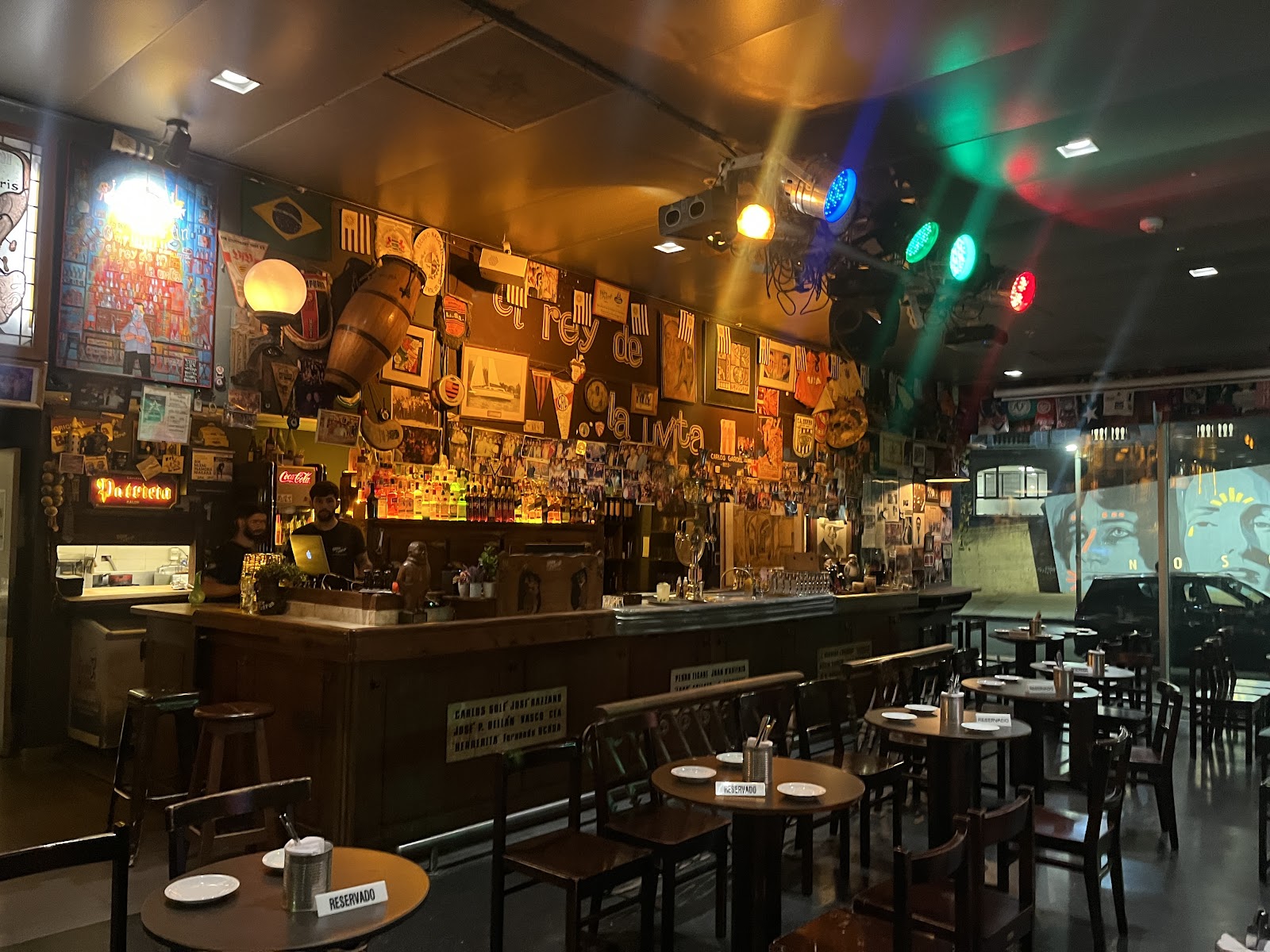 Aged bar interior with dark wood and memorabilia