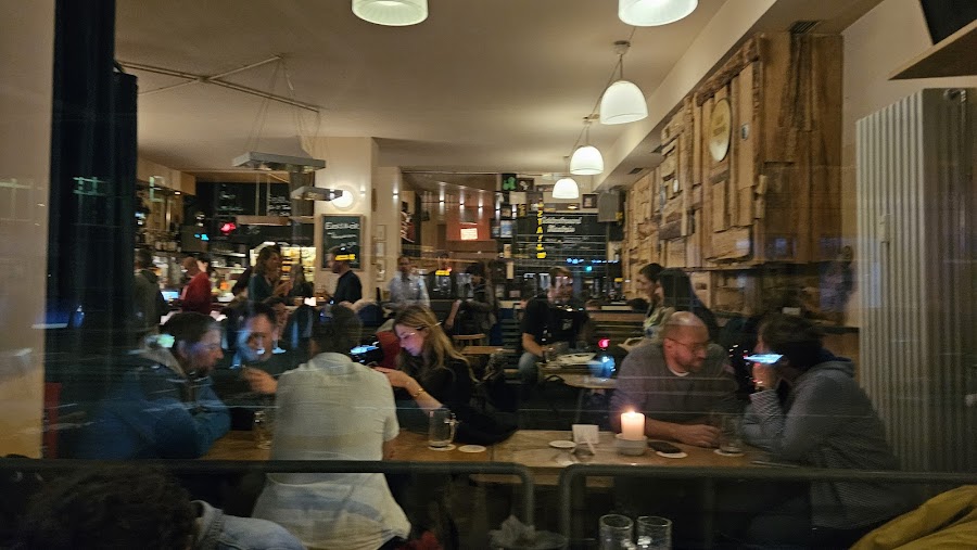 Crowded vintage-styled bar in the evening