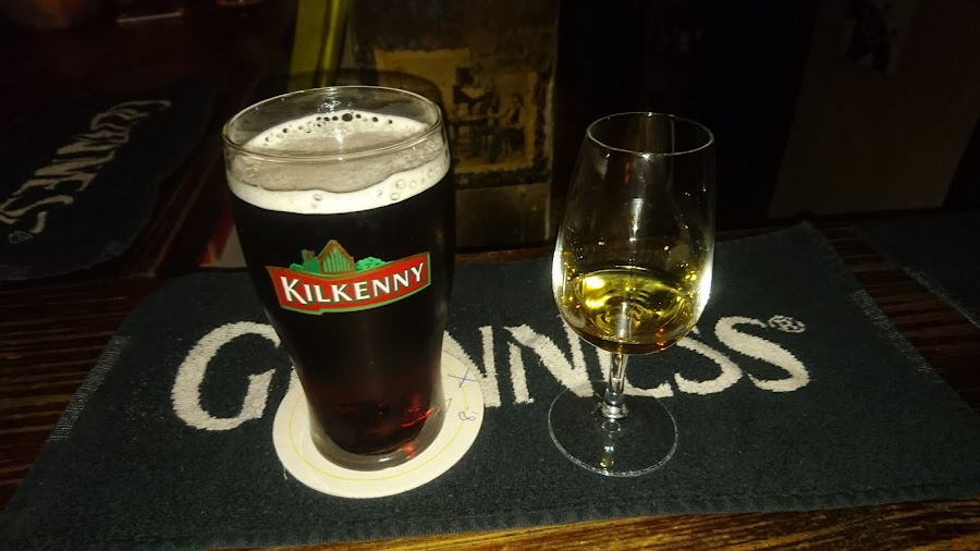 Pints of stout on an Irish pub bar