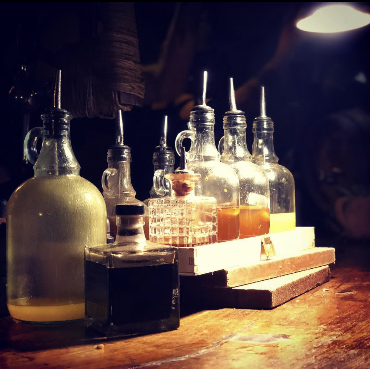 Ex Salumeria Naples rum bottles back bar