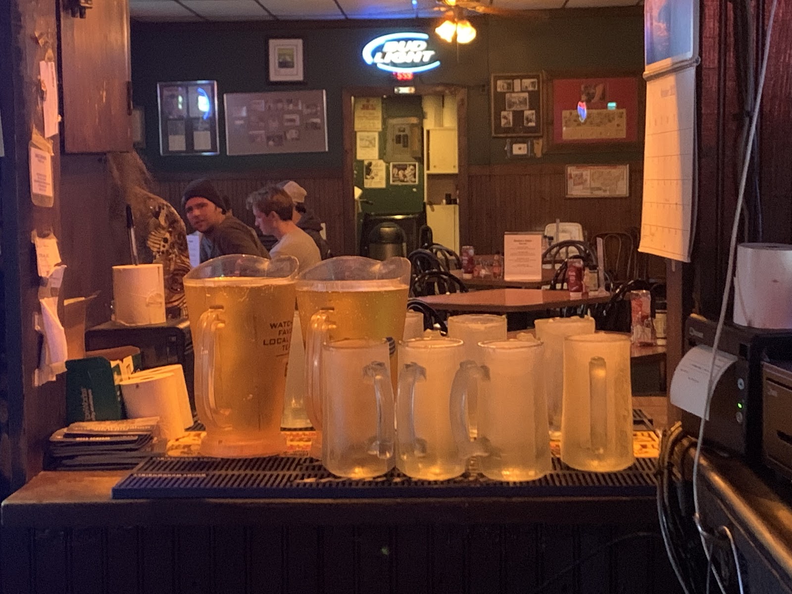 Worn wooden bar and stools inside a historic Nashville dive bar