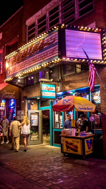Intimate Lower Broadway honky tonk with a roots band on a small stage in Nashville