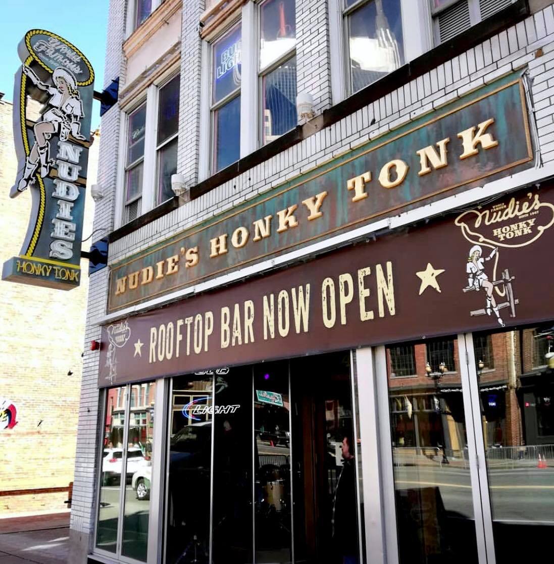 Live country band on stage at a Lower Broadway honky tonk in Nashville