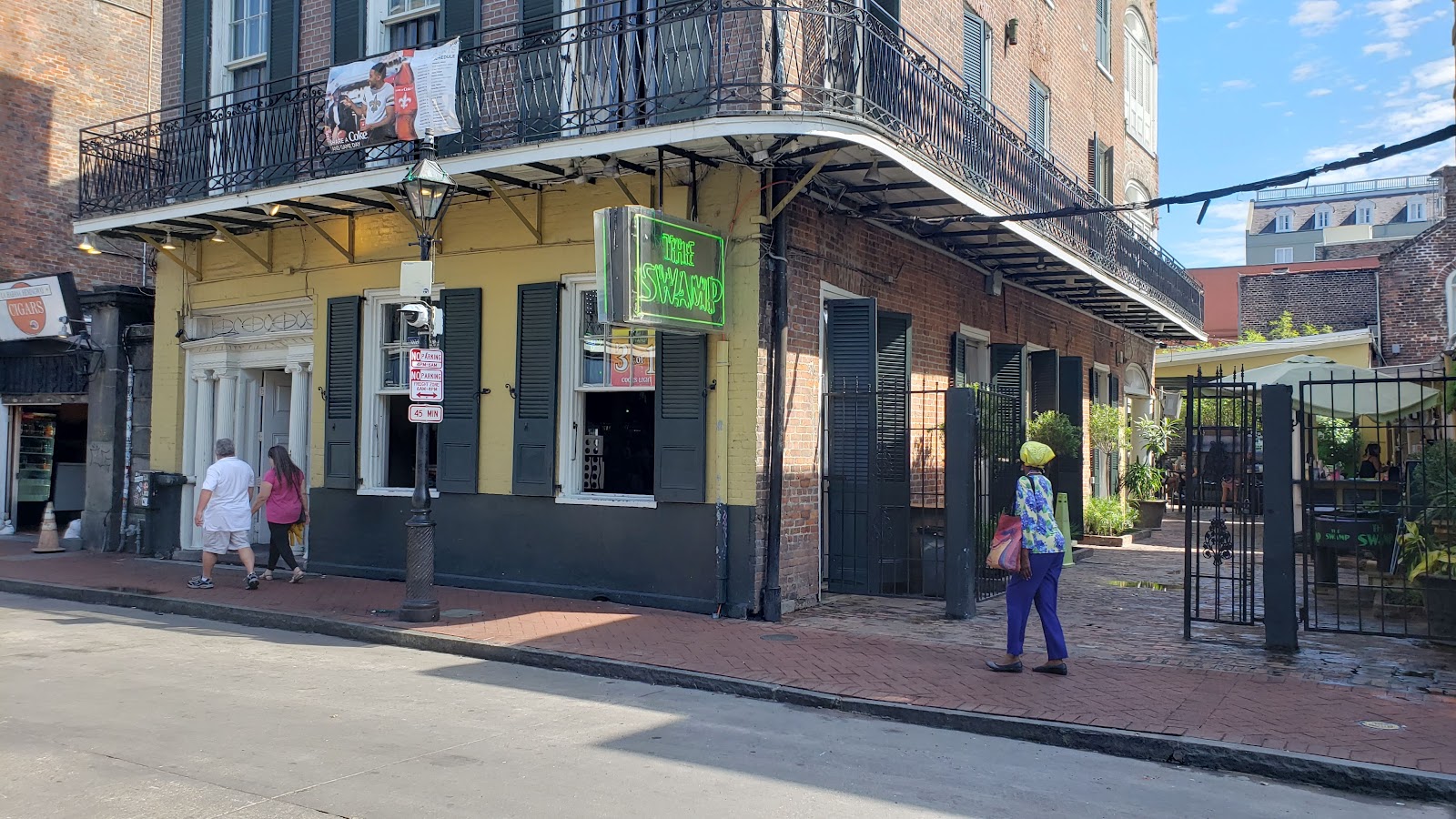 Two-story Bourbon Street bar with a large balcony in New Orleans