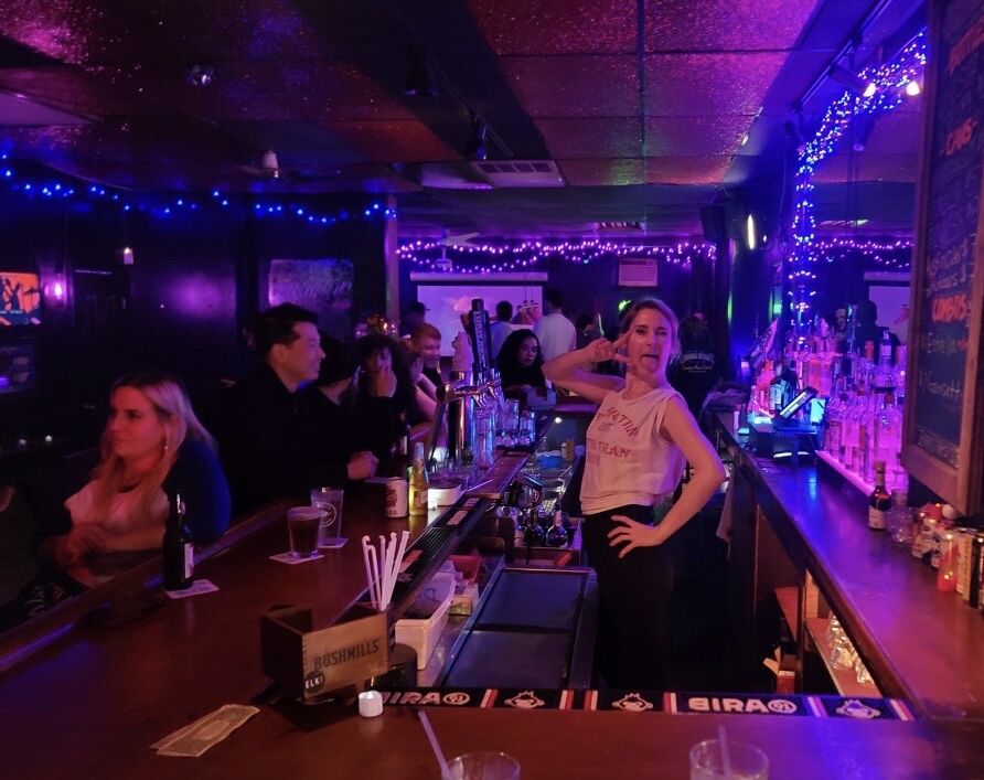 Dim dive bar room with low lighting