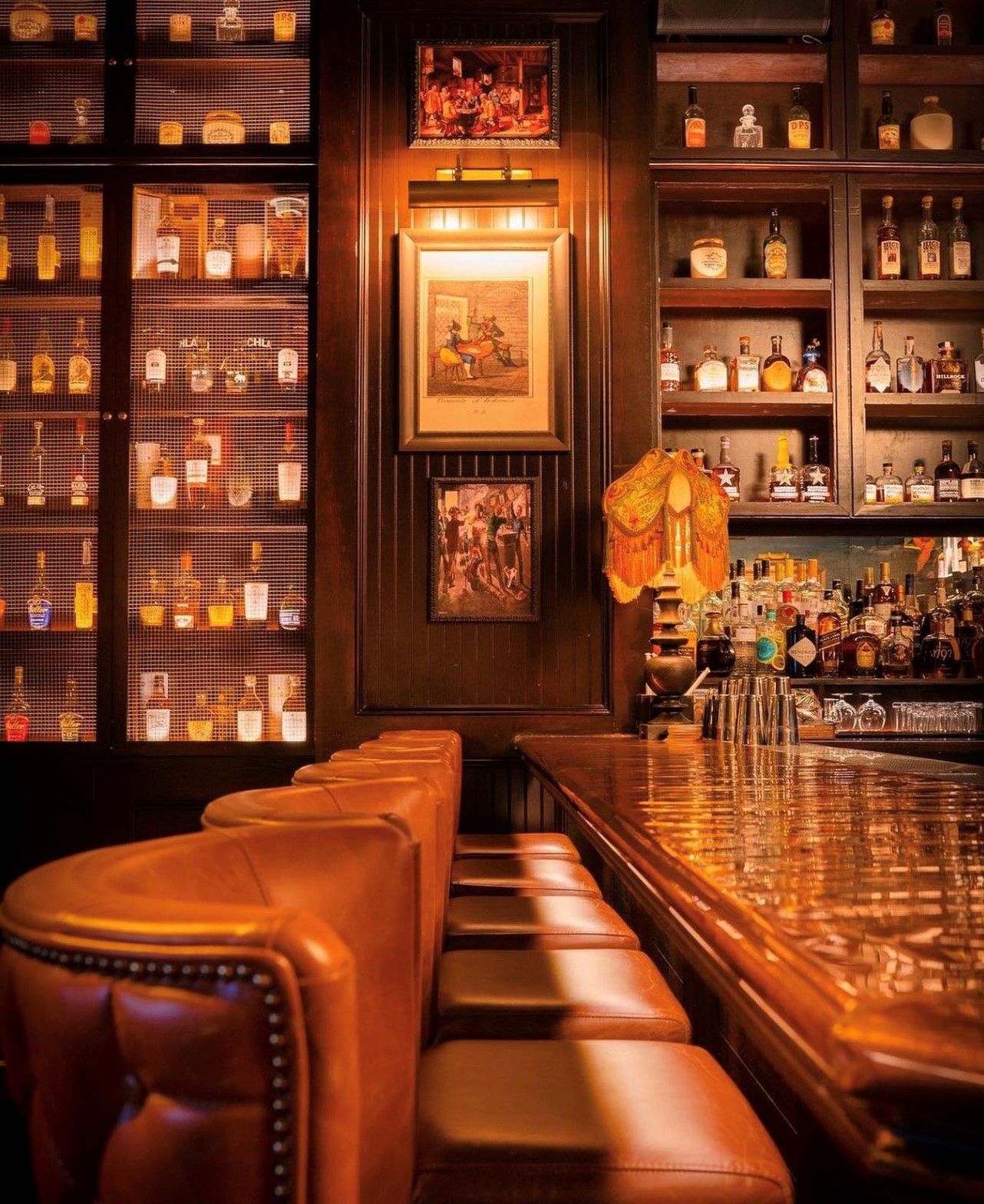 Dim whiskey bar interior like The Parlour Room