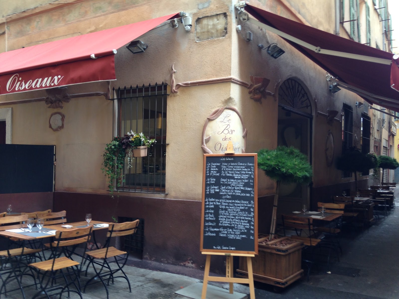 Le Bar des Oiseaux Nice bistro interior with art on the walls