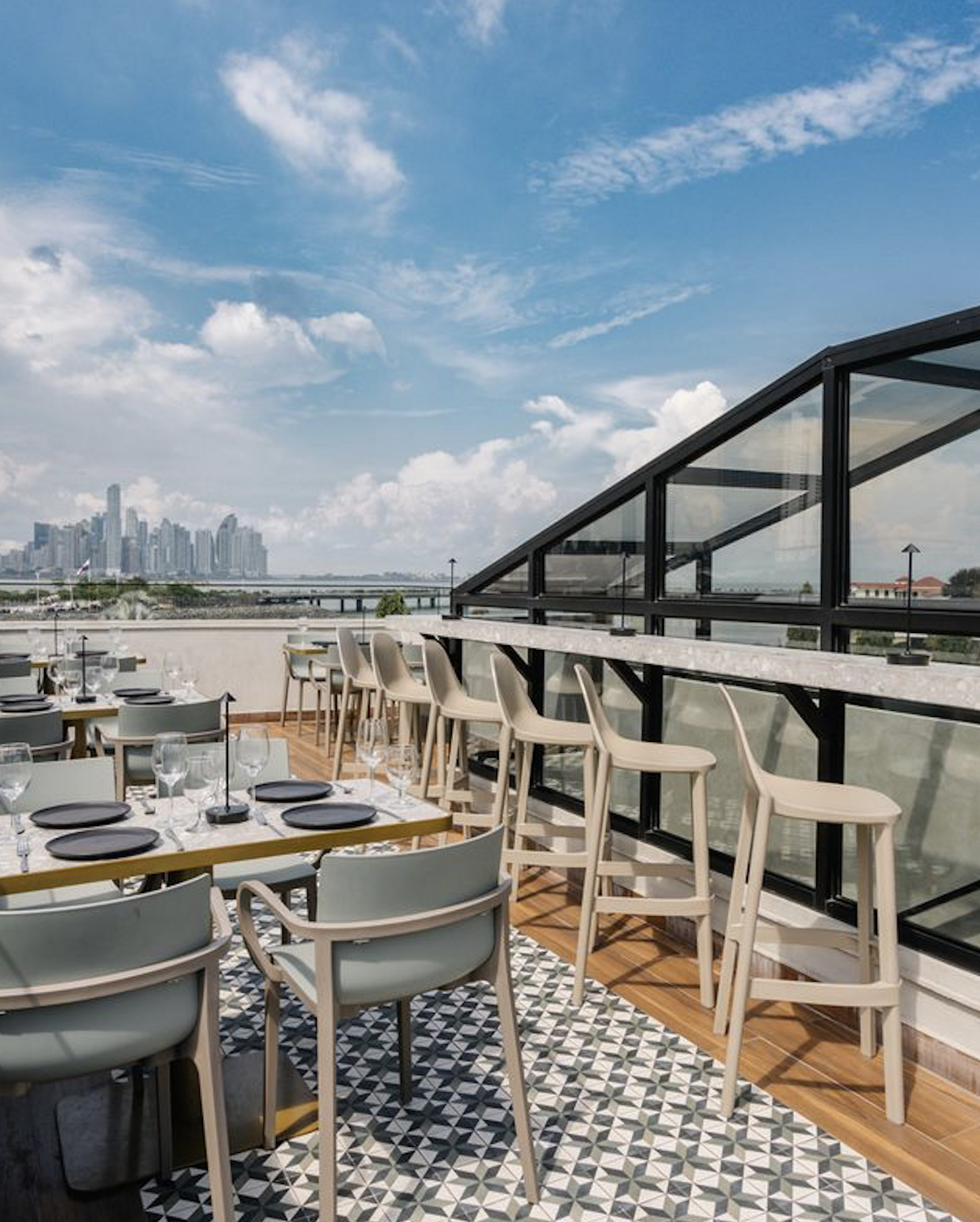 Rooftop bar terrace overlooking the Panama City skyline at dusk