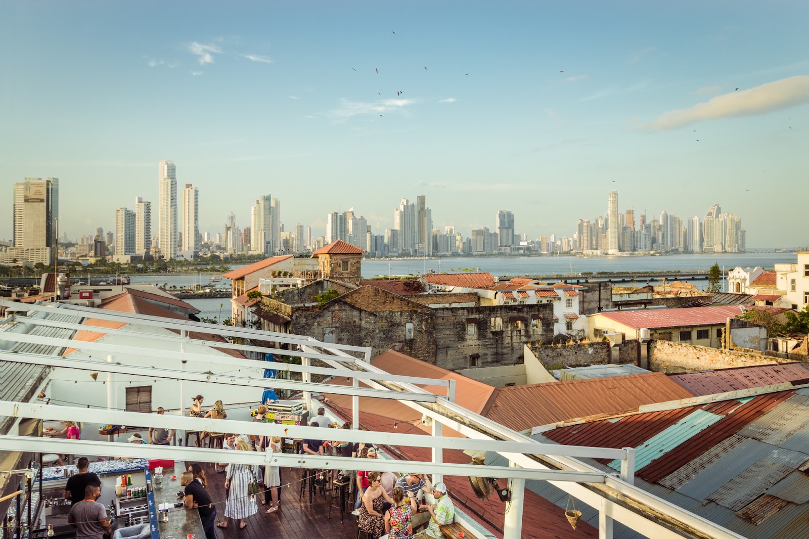 Rooftop bar at dusk overlooking Casco Viejo Panama City