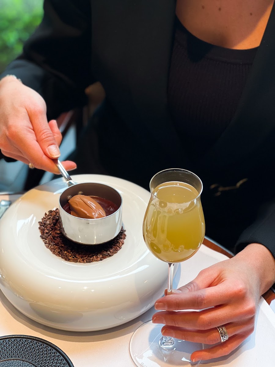A crafted cocktail on a marble bar
