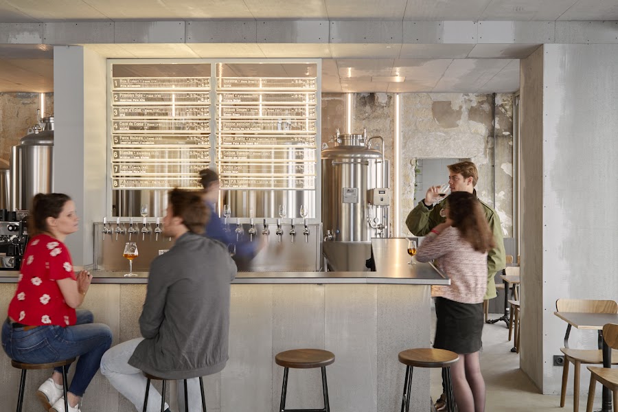 Row of taps pouring craft beer