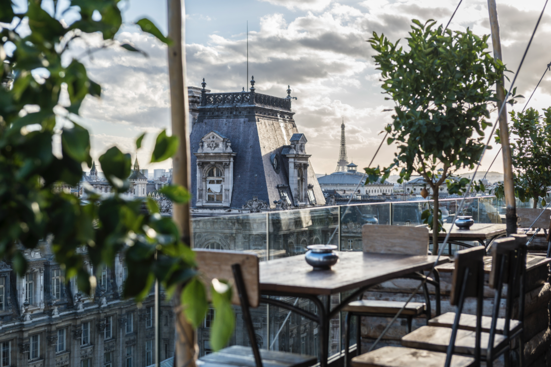 Paris rooftop view at dusk like Le Perchoir Marais