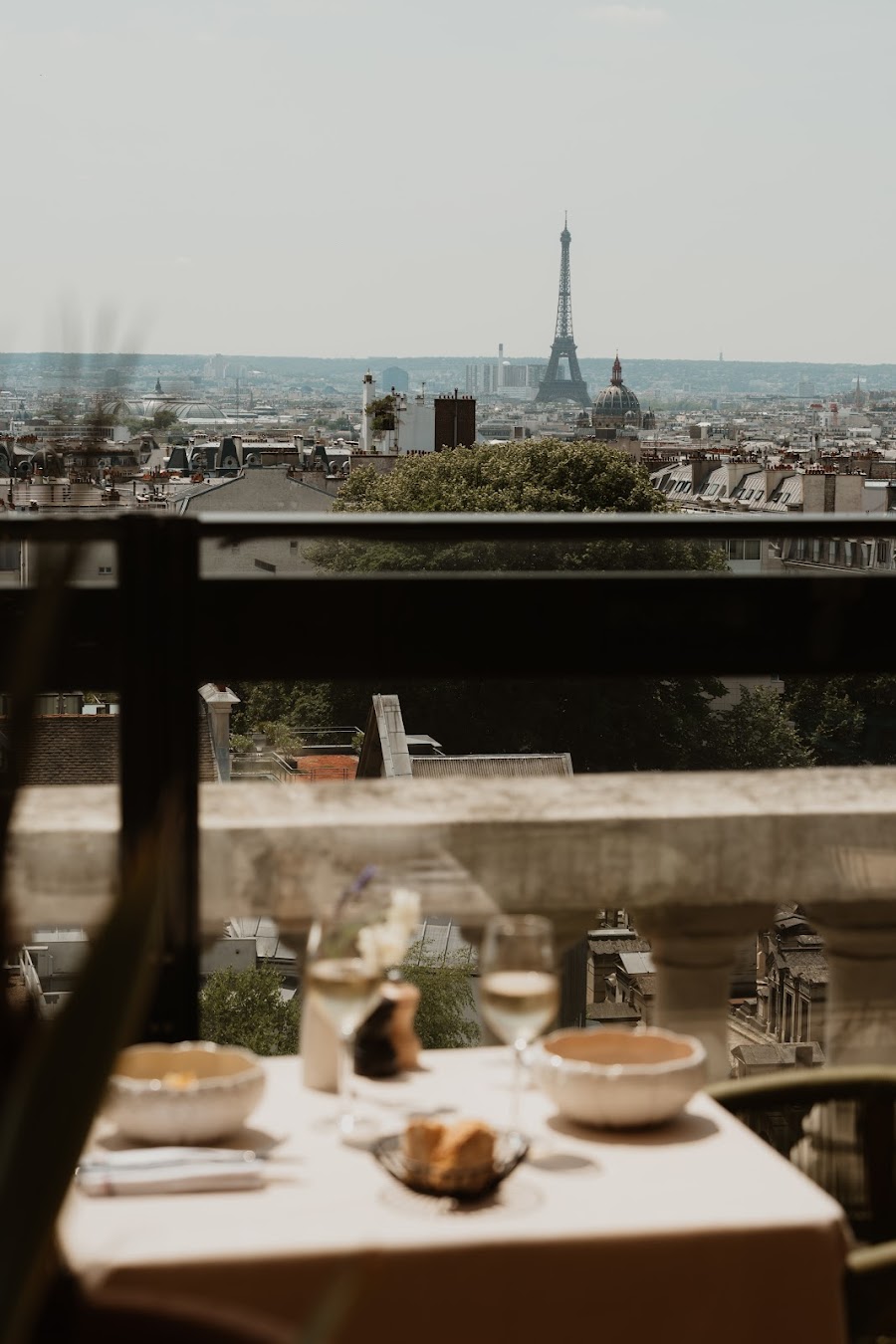 Warm-lit open-air bar at dusk