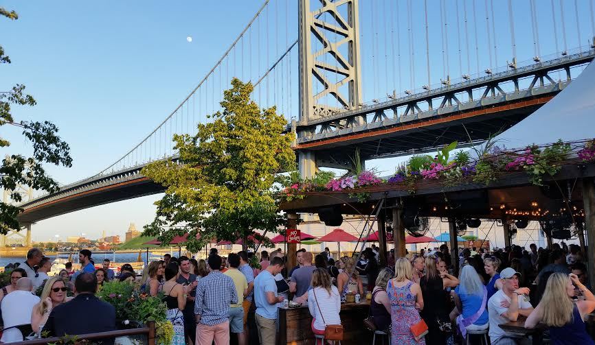 Frozen cocktails at an outdoor bar under the Ben Franklin Bridge