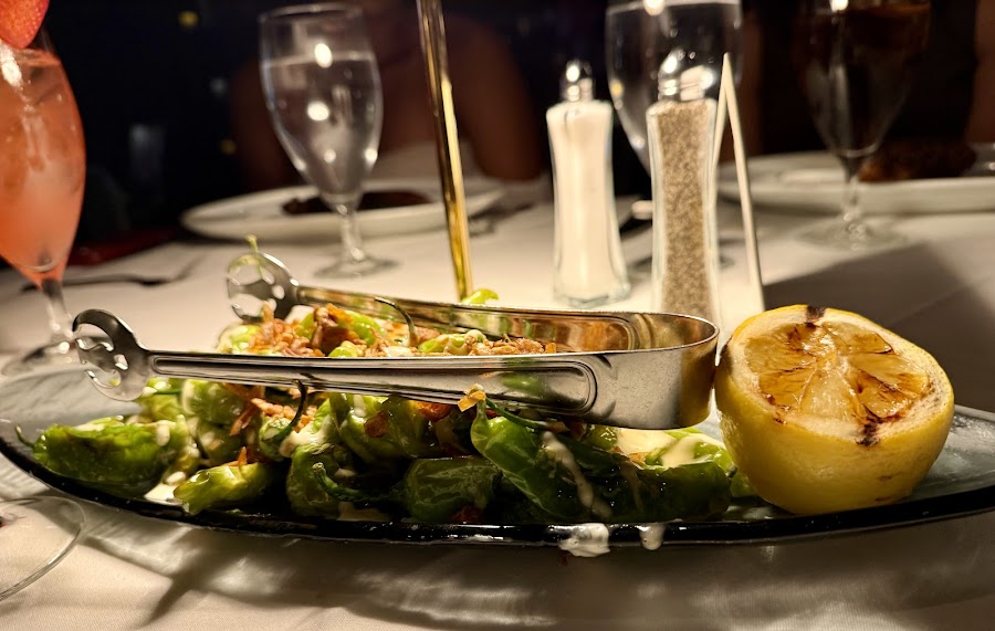 Rooftop poolside dining terrace at a steakhouse
