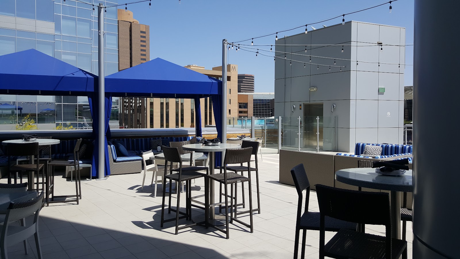 Rooftop garden bar with lounge seating and downtown Phoenix views
