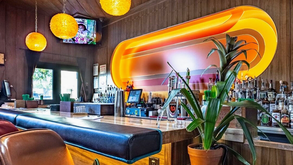 Retro wood-paneled bar room at a Phoenix lounge