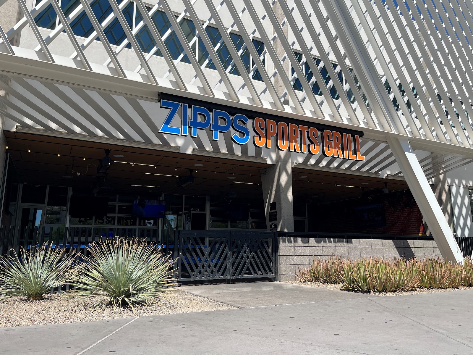 Sports bar interior with screens and a long bar in midtown Phoenix