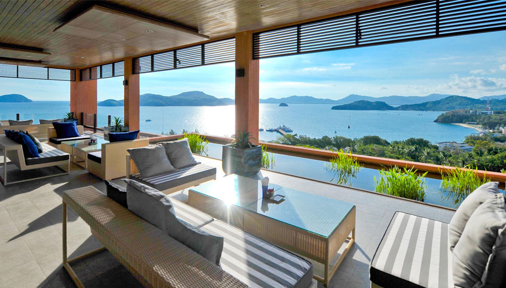 Baba Nest rooftop deck at sunset over the Andaman Sea