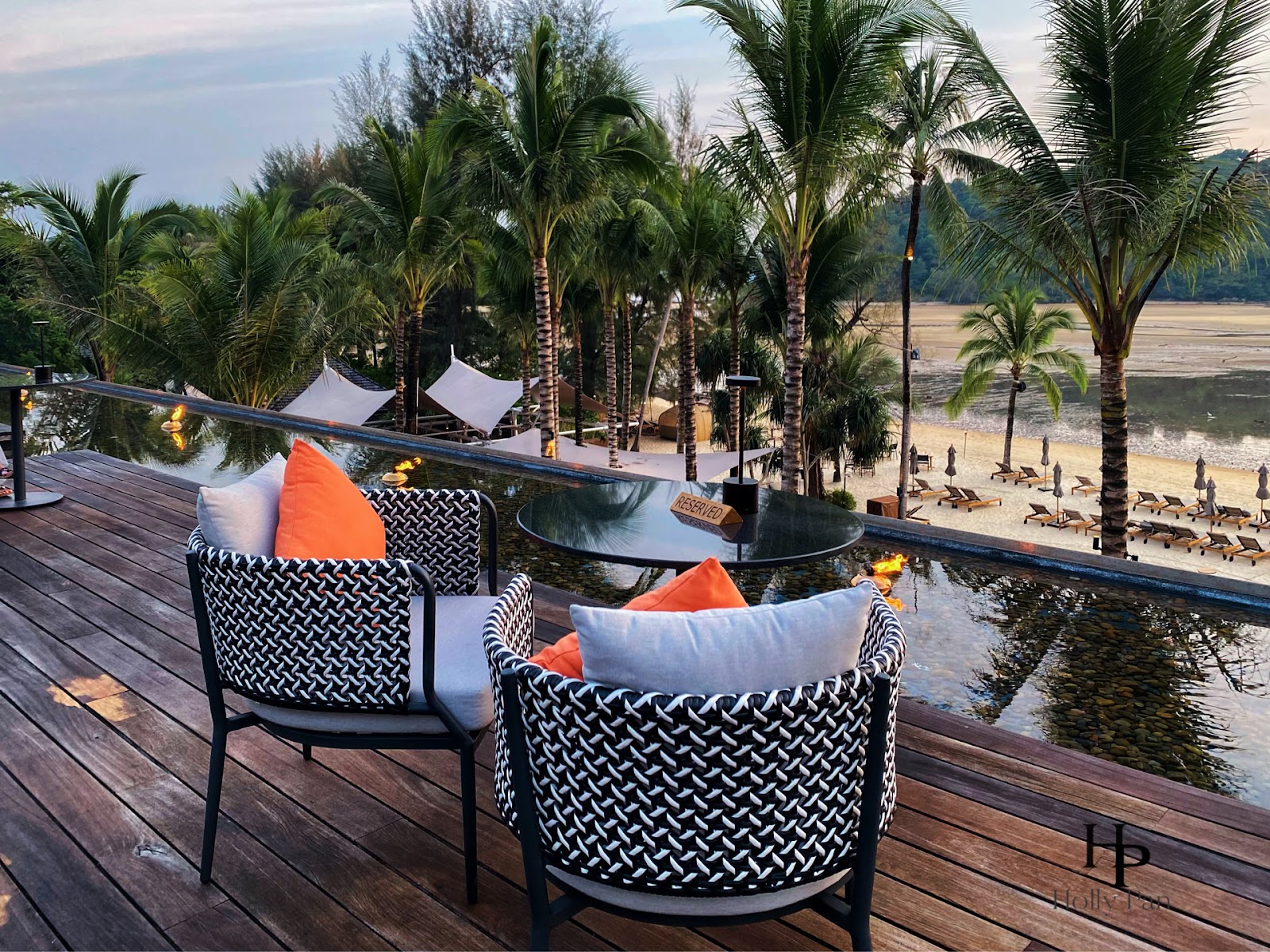 Beach House Rooftop wooden deck over Layan Beach at sunset