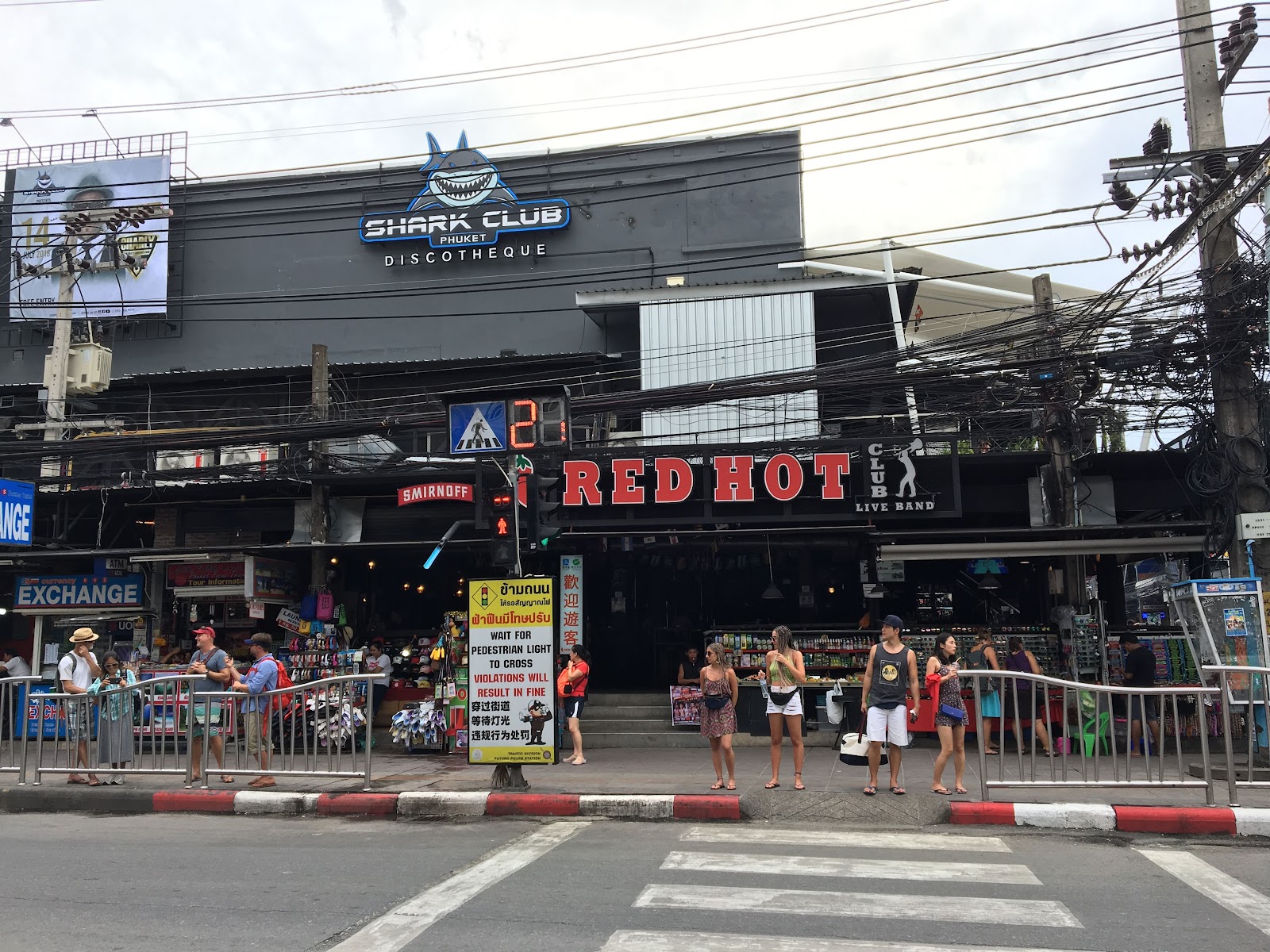Open fronted live music bar with stage lights at night