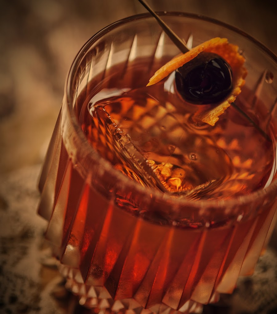 Prohibition-era cocktails on a vintage wooden bar
