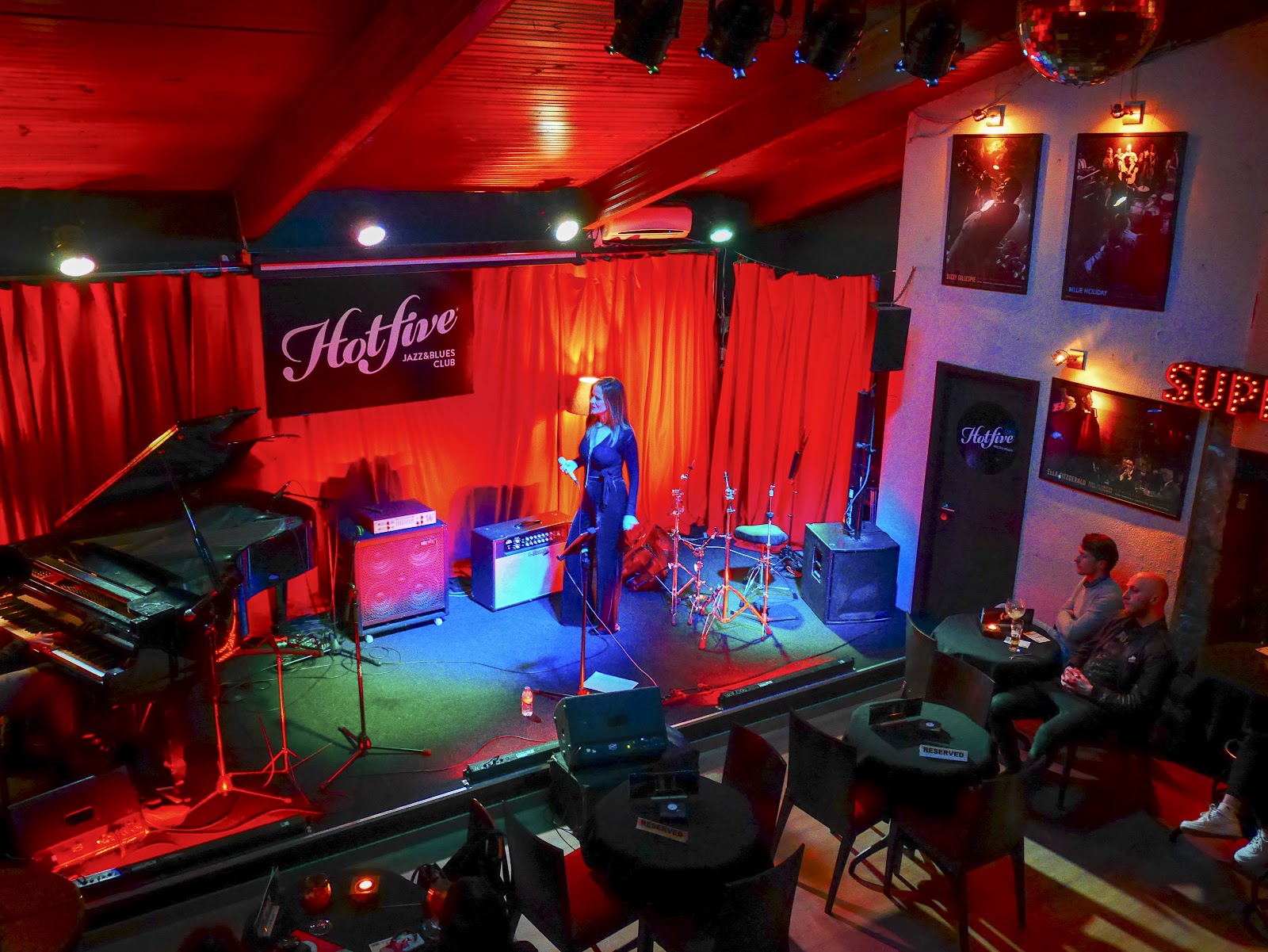 Hot Five Jazz and Blues Club Porto stage and tables in low light