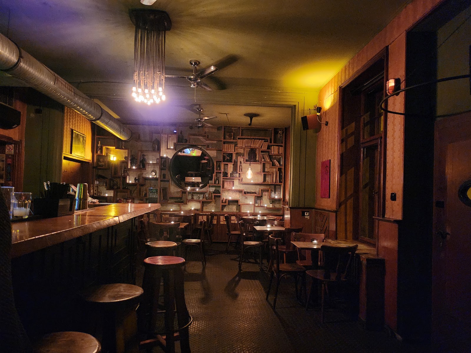 Bukowski's Bar dim candlelit interior, Žižkov Prague