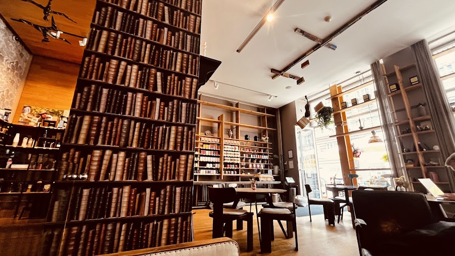 Big windows and wooden tables at Prádelna, Vinohrady Prague